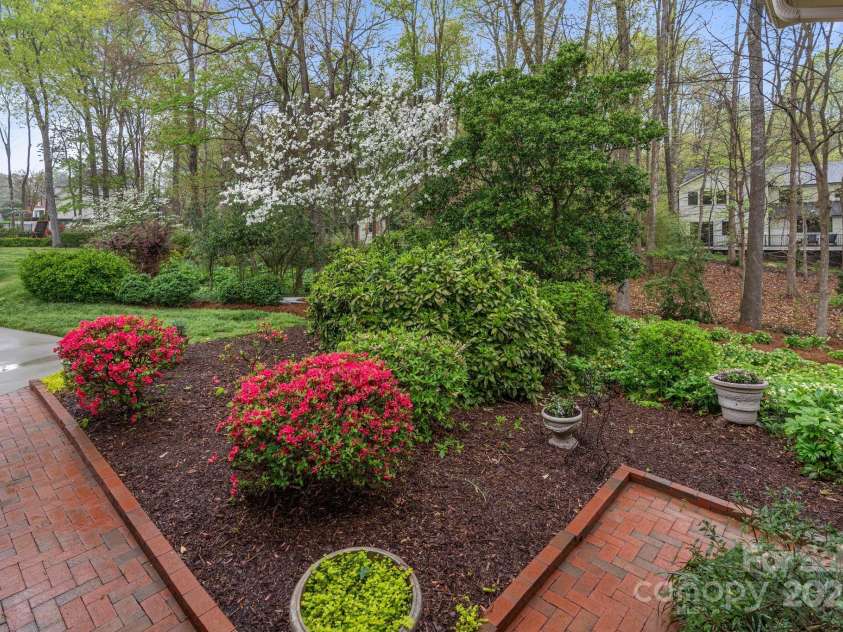 5125 Winding Brook Road, Charlotte, NC 28226.  MLS# CAR4241035, YatesRealty ID 18729. Brick Pathway leads to Screened Porch