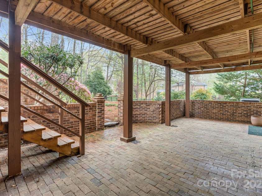 5125 Winding Brook Road, Charlotte, NC 28226.  MLS# CAR4241035, YatesRealty ID 18729. Brick Patio off Basement