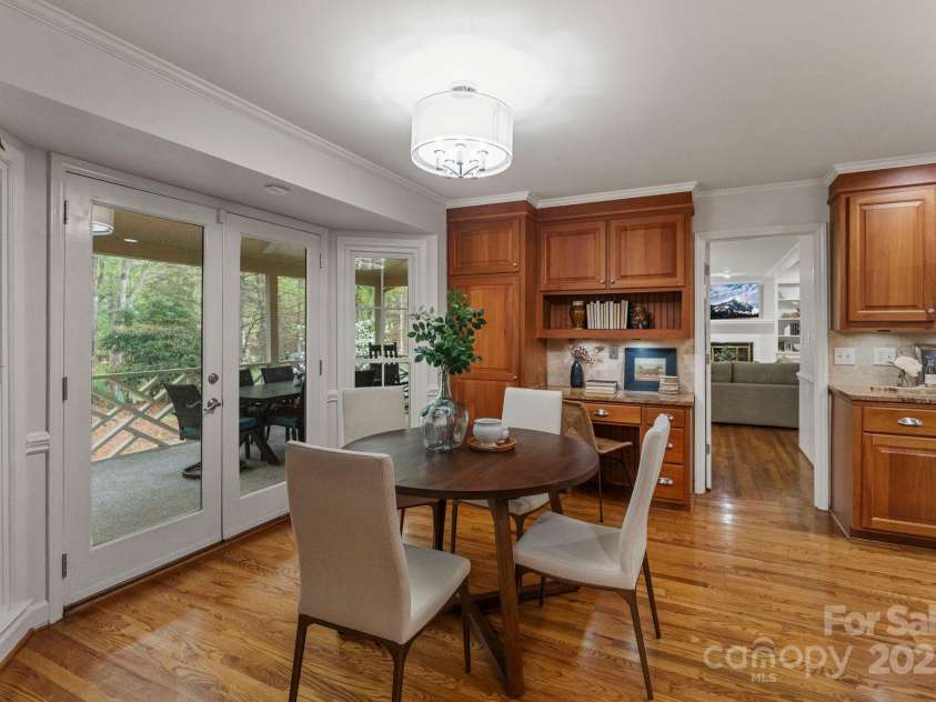 5125 Winding Brook Road, Charlotte, NC 28226.  MLS# CAR4241035, YatesRealty ID 18729. Kitchen opens up to screened porch