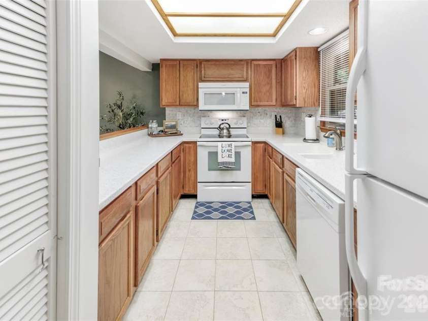 385 Whitney Boulevard, Lake Lure, NC 28746.  MLS# CAR4351319, YatesRealty ID 18735. 