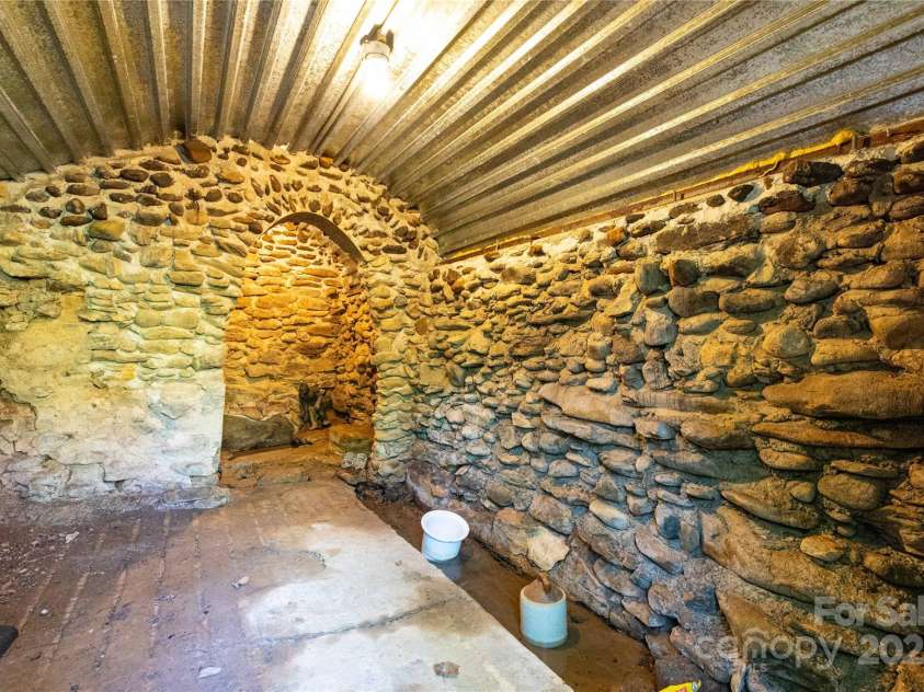 28 & 29 Spruce Chase Lane, Swannanoa, NC 28778.  MLS# CAR4251000, YatesRealty ID 18737. Interior of reconstructed spring house
