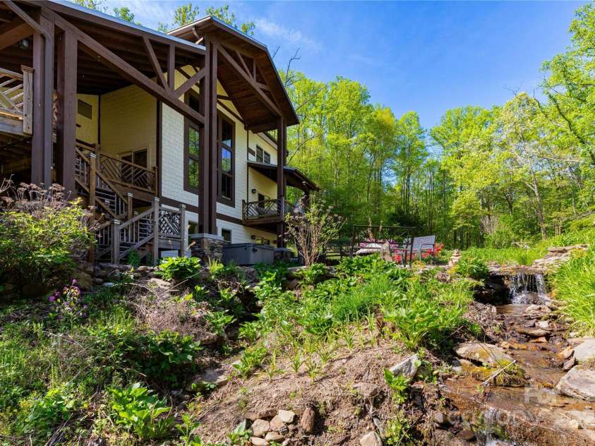 28 & 29 Spruce Chase Lane, Swannanoa, NC 28778.  MLS# CAR4251000, YatesRealty ID 18737. Main Home with waterfall