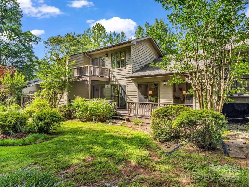 8 Hunting Country Trail, Tryon, NC 28782.  MLS# CAR4244551, YatesRealty ID 18739. Back deck with easy access to the back yard of this pet friendly unit