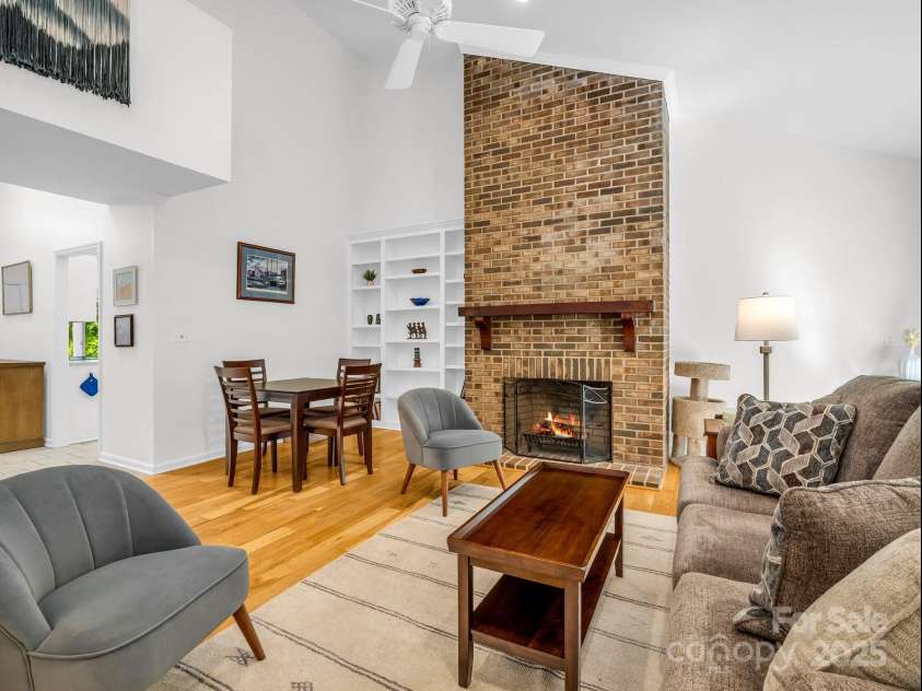 8 Hunting Country Trail, Tryon, NC 28782.  MLS# CAR4244551, YatesRealty ID 18739. Built-ins in left of the wood burning fireplace