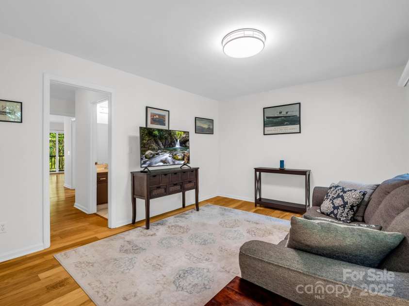 8 Hunting Country Trail, Tryon, NC 28782.  MLS# CAR4244551, YatesRealty ID 18739. Den to the right of the entrance could also be used as a bedroom