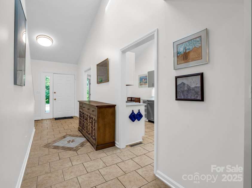 8 Hunting Country Trail, Tryon, NC 28782.  MLS# CAR4244551, YatesRealty ID 18739. Entrance with tile flooring