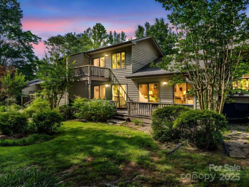 8 Hunting Country Trail, Tryon, NC 28782.  MLS# CAR4244551, YatesRealty ID 18739. Evening view of the back of the unit