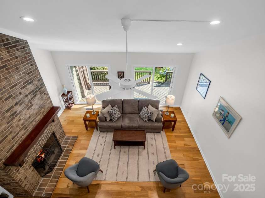 8 Hunting Country Trail, Tryon, NC 28782.  MLS# CAR4244551, YatesRealty ID 18739. From the loft looking down on the living/dining room