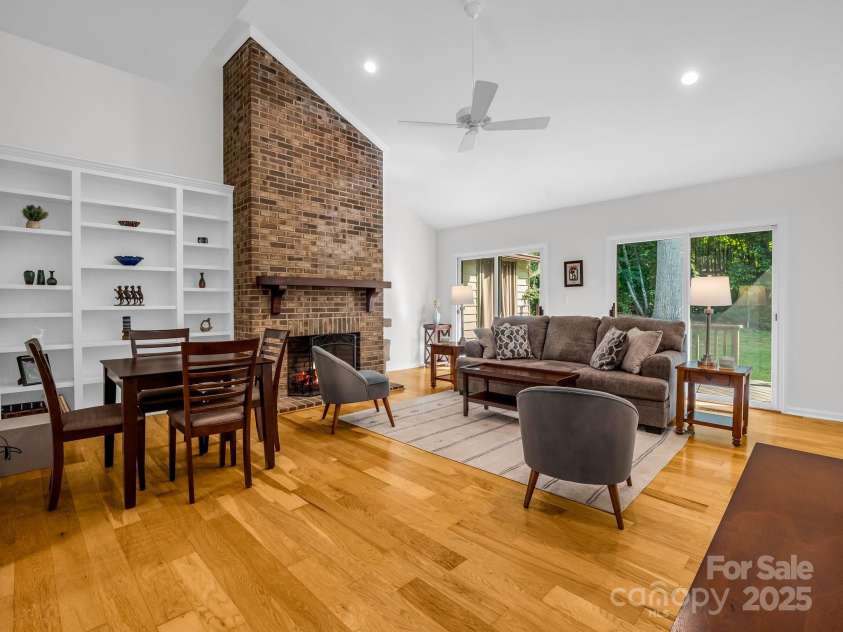 8 Hunting Country Trail, Tryon, NC 28782.  MLS# CAR4244551, YatesRealty ID 18739. Great room with soaring ceilings and wood burning fireplace