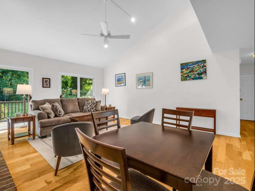 8 Hunting Country Trail, Tryon, NC 28782.  MLS# CAR4244551, YatesRealty ID 18739. Living/Dining area open to a back deck