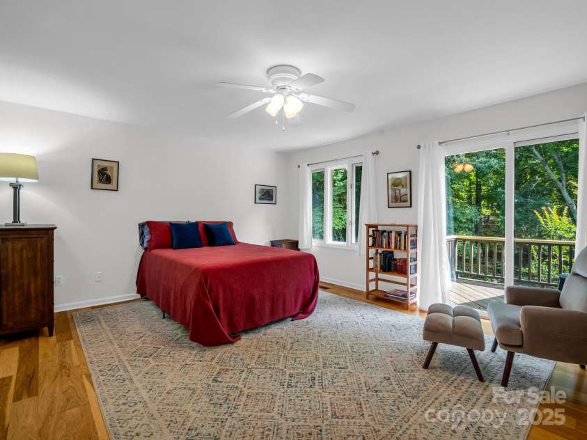 8 Hunting Country Trail, Tryon, NC 28782.  MLS# CAR4244551, YatesRealty ID 18739. Upper level bedroom suite with private deck