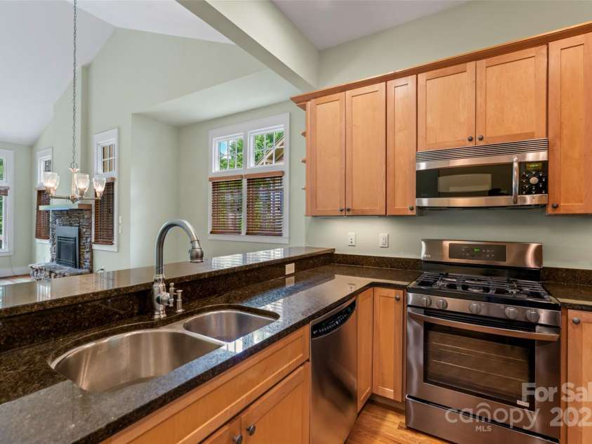 50 Mandolin Drive, Black Mountain, NC 28711.  MLS# CAR4264408, YatesRealty ID 18743. All your artwork will fit comfortably in the home with its high ceilings, which are over 9.6 and 10 feet high throughout! Plus, your dishes and all your cookware will have plenty of room in the extra-tall kitchen ca