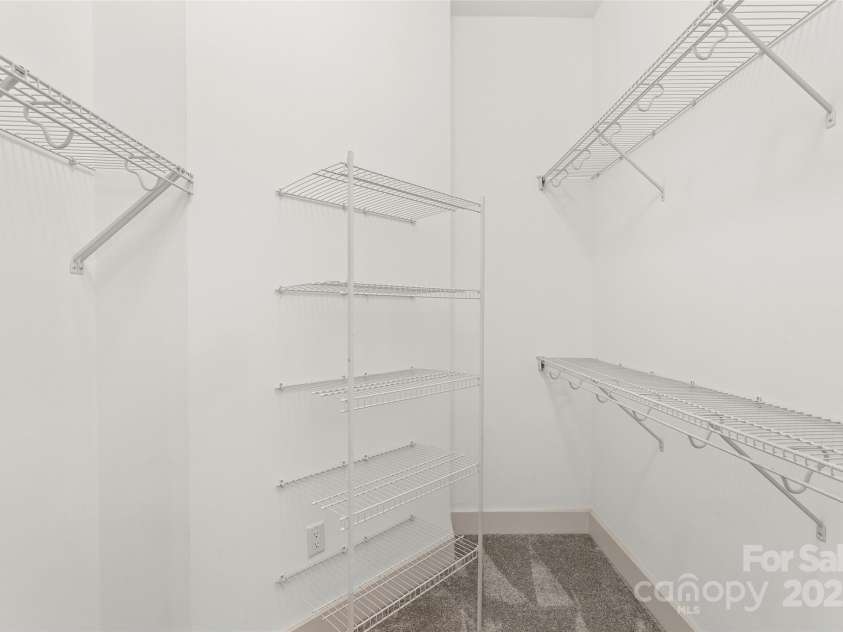 50 Mandolin Drive, Black Mountain, NC 28711.  MLS# CAR4264408, YatesRealty ID 18743. An ensuite master bathroom can be found just off the master bedroom. It also has a spacious walk-in closet, equipped with ample shelving.