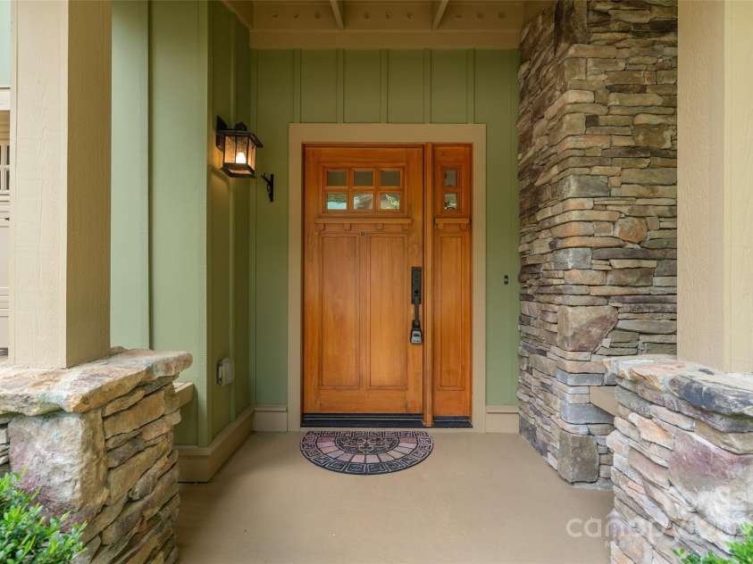 50 Mandolin Drive, Black Mountain, NC 28711.  MLS# CAR4264408, YatesRealty ID 18743. Step into an idyllic Arts and Crafts style haven where a grand entry adorned with stacked stone greets and welcomes you home!