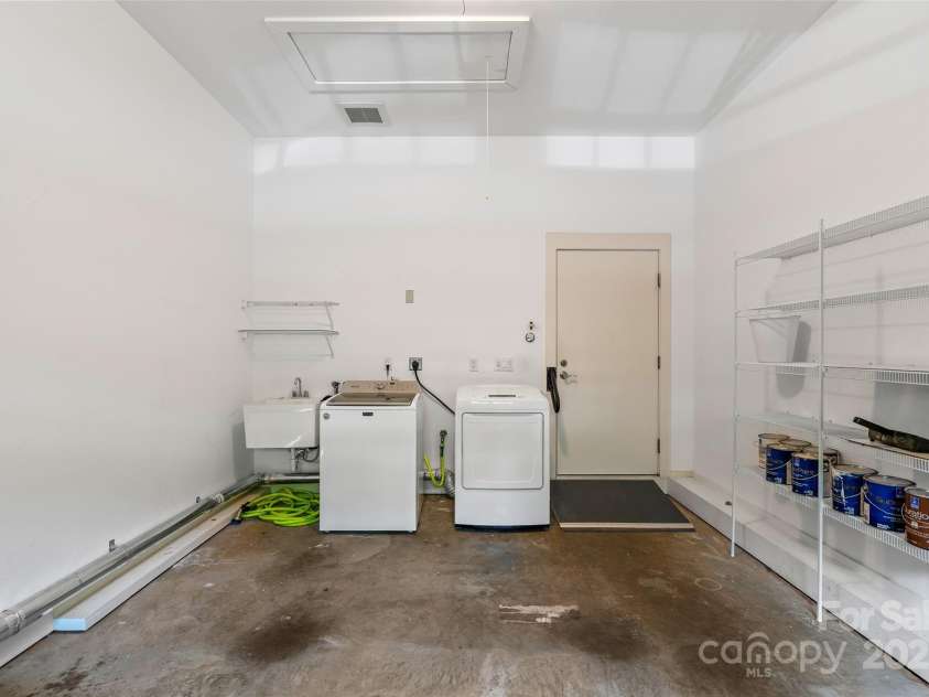 50 Mandolin Drive, Black Mountain, NC 28711.  MLS# CAR4264408, YatesRealty ID 18743. The house is built with convenience in mind. The washer and dryer are located on the main level in the garage. There is also a grab bar and slight ramp up entering the home to help with anyone visiting that may appr