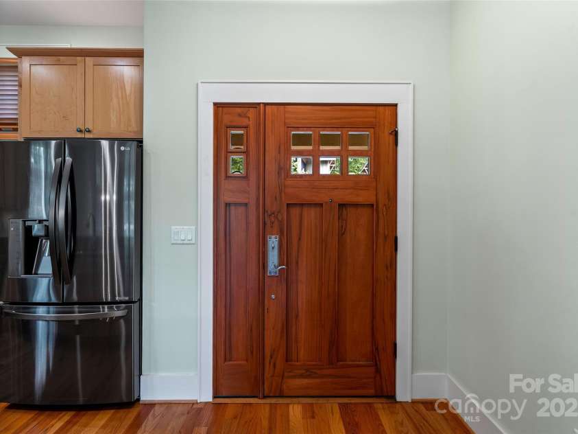 50 Mandolin Drive, Black Mountain, NC 28711.  MLS# CAR4264408, YatesRealty ID 18743. The kitchen is located right at the front entrance, which is ideal for unloading groceries or the yummy leftovers from one of the many delicious to die for restaurants just 5 minutes away in downtown Black Mountain 