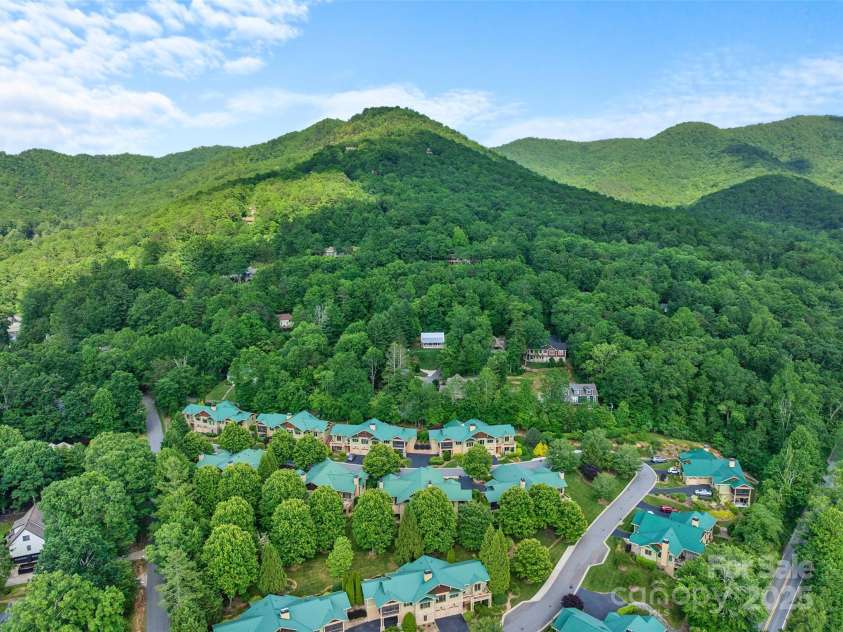 50 Mandolin Drive, Black Mountain, NC 28711.  MLS# CAR4264408, YatesRealty ID 18743. The Nine South Community is well maintained and professionally landscaped with native plants. It has a paved two-lane road with roll valley curbing, recreational space and a walking trail.