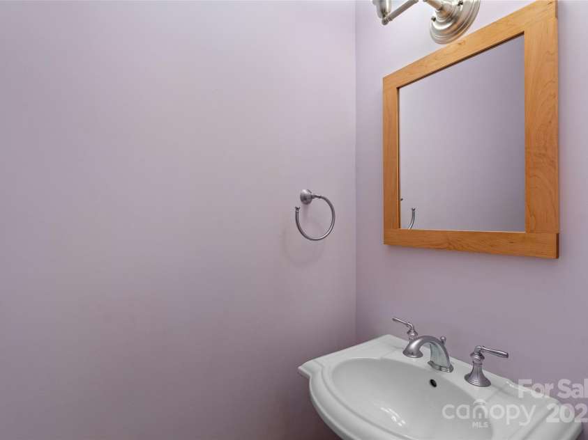 50 Mandolin Drive, Black Mountain, NC 28711.  MLS# CAR4264408, YatesRealty ID 18743. There is also a half bath located on the main level just as you enter the home from the attached garage. This bathroom is also convenient for guests as it is close to the living and dining areas.