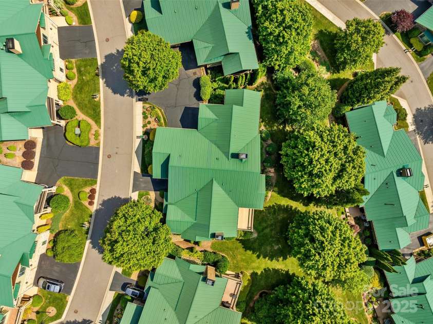 50 Mandolin Drive, Black Mountain, NC 28711.  MLS# CAR4264408, YatesRealty ID 18743. These townhomes are beautiful, green metal roofs, all underground utilities, decorative low-intensity street lighting and city water/sewer and natural gas!
