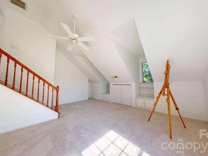 6501 Outer Bridge Lane, Charlotte, NC 28270.  MLS# CAR4377519, YatesRealty ID 18747. Bonus room with built-in storage and vaulted ceiling.