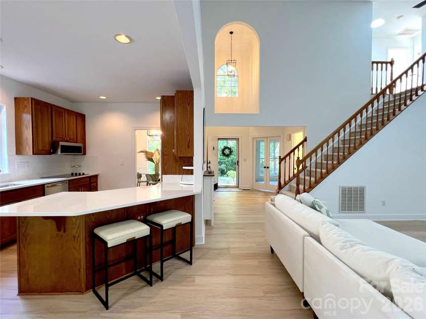6501 Outer Bridge Lane, Charlotte, NC 28270.  MLS# CAR4377519, YatesRealty ID 18747. Extra deep peninsula with bar stools.