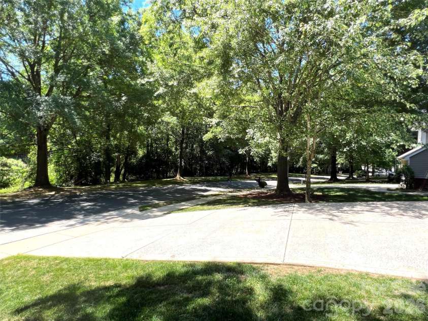 6501 Outer Bridge Lane, Charlotte, NC 28270.  MLS# CAR4377519, YatesRealty ID 18747. View down street.