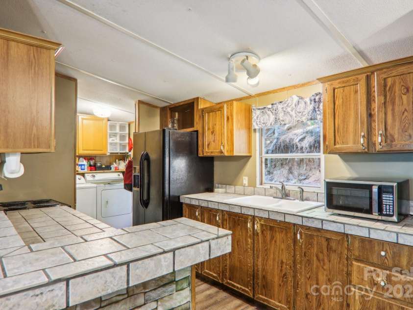 138 Buddy Lane, Chimney Rock, NC 28720.  MLS# CAR4326250, YatesRealty ID 1875. 