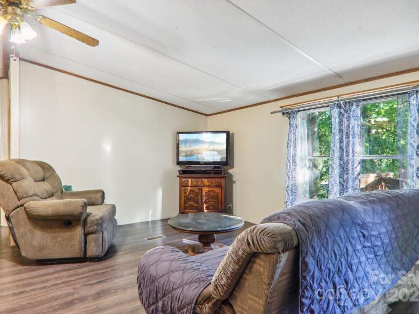 138 Buddy Lane, Chimney Rock, NC 28720.  MLS# CAR4326250, YatesRealty ID 1875. Large living room