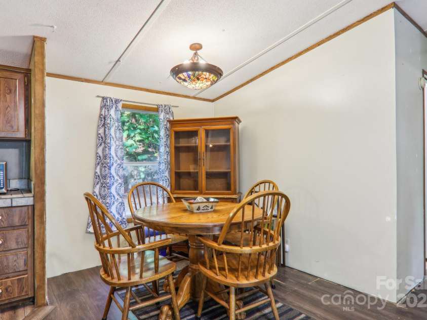 138 Buddy Lane, Chimney Rock, NC 28720.  MLS# CAR4326250, YatesRealty ID 1875. Oak dining table and cabinet can convey with sale if buyer wants
