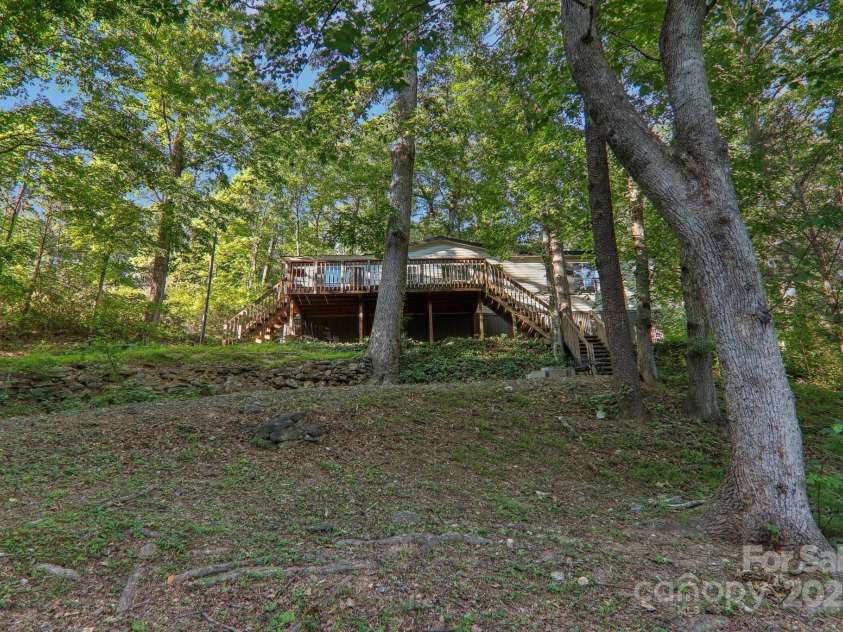 138 Buddy Lane, Chimney Rock, NC 28720.  MLS# CAR4326250, YatesRealty ID 1875. Private location 1 minute drive to Flowering Bridge 