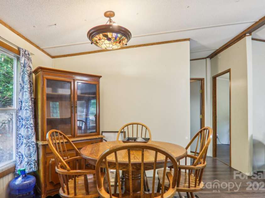 138 Buddy Lane, Chimney Rock, NC 28720.  MLS# CAR4326250, YatesRealty ID 1875. Seller will leave oak table and hutch if anyone interested