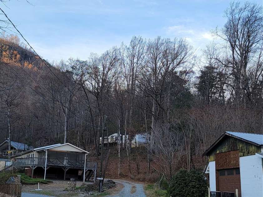 138 Buddy Lane, Chimney Rock, NC 28720.  MLS# CAR4326250, YatesRealty ID 1875. This shot is taken from corner of Buddy lane and Memorial Hwy. It shows how close this property is to everything, yet tucked away