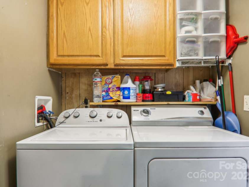 138 Buddy Lane, Chimney Rock, NC 28720.  MLS# CAR4326250, YatesRealty ID 1875. Washer/dryer area off kitchen at back door