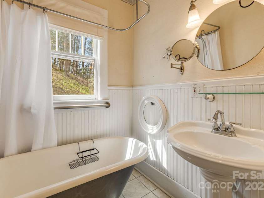 153 Skyway Drive, Marshall, NC 28753.  MLS# CAR4239069, YatesRealty ID 18756. Downstairs Bathroom