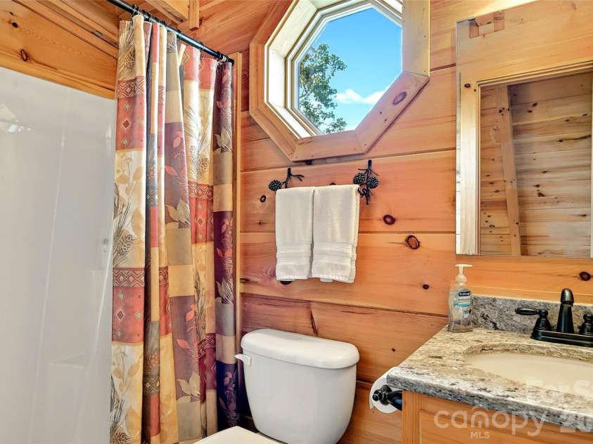 96 Boysenberry Drive, Nebo, NC 28761.  MLS# CAR4378024, YatesRealty ID 18759. Upstairs Bathroom