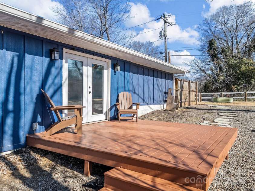 435 Thermal View Drive, Tryon, NC 28782.  MLS# CAR4334421, YatesRealty ID 1876. Deck off of the dining area