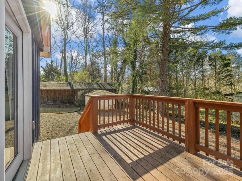 435 Thermal View Drive, Tryon, NC 28782.  MLS# CAR4334421, YatesRealty ID 1876. Deck off the primary bedroom