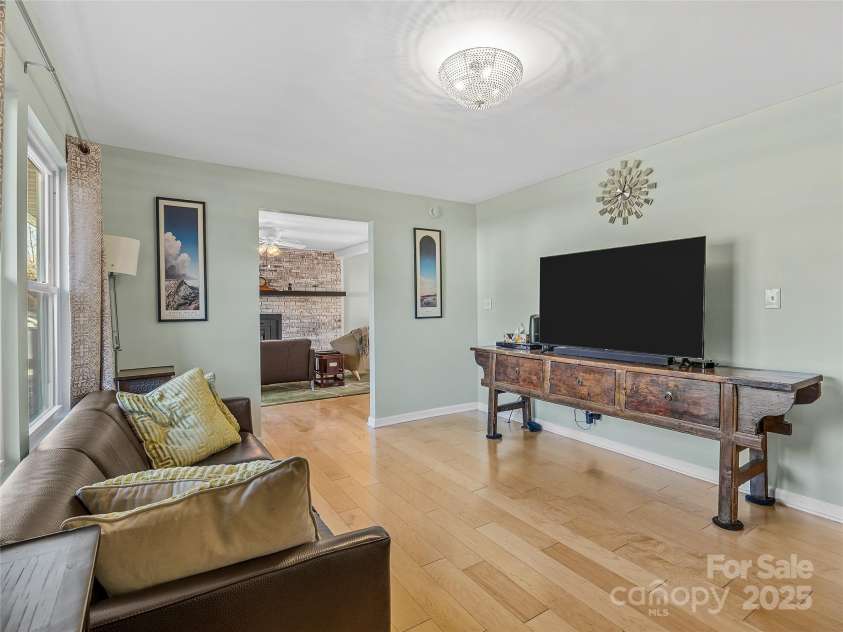 435 Thermal View Drive, Tryon, NC 28782.  MLS# CAR4334421, YatesRealty ID 1876. Living room looking into the family room.