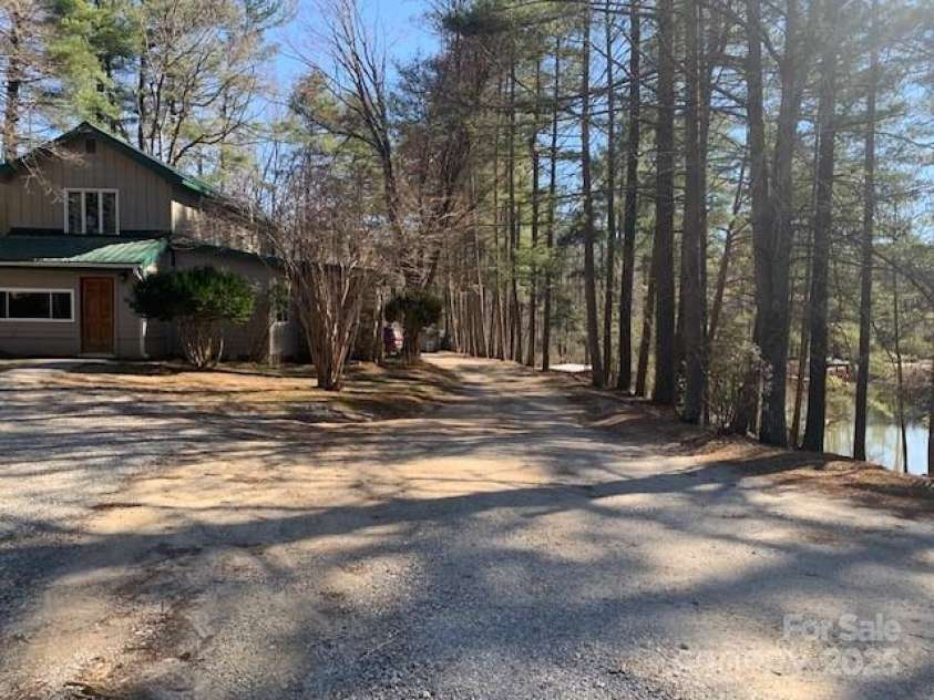 50A LAKEMONT COTTAGE Trail, Flat Rock, NC 28739.  MLS# CAR4233263, YatesRealty ID 1876. LEFT: ENDLESS VIEWSRIGHT: PEACEFUL POND