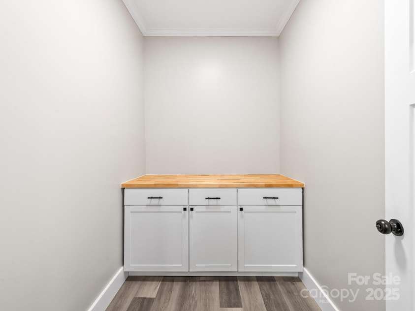 123 Edwards Avenue, Swannanoa, NC 28778.  MLS# CAR4265830, YatesRealty ID 18765. This room off the kitchen would make a great walk-in pantry.