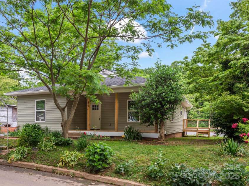 123 Edwards Avenue, Swannanoa, NC 28778.  MLS# CAR4265830, YatesRealty ID 18765. Trees and greenery create privacy and shade.