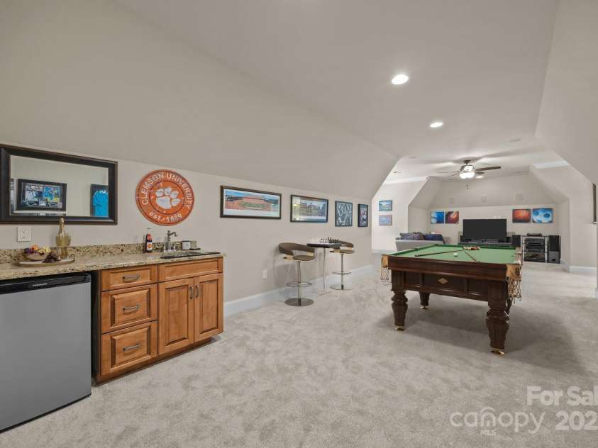 104 Golden Bell Court, Mooresville, NC 28117.  MLS# CAR4258301, YatesRealty ID 18768. Staged Pool table & chairs