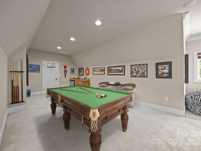 104 Golden Bell Court, Mooresville, NC 28117.  MLS# CAR4258301, YatesRealty ID 18768. Staged Pool table & chairs
