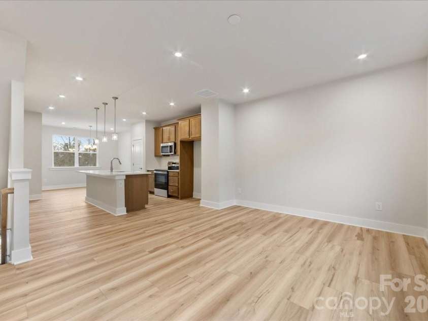 6008 Pivot Court, Charlotte, NC 28205.  MLS# CAR4396115, YatesRealty ID 18768. Light filled great room