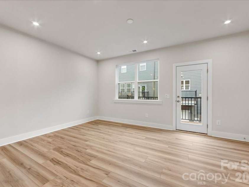 6008 Pivot Court, Charlotte, NC 28205.  MLS# CAR4396115, YatesRealty ID 18768. Living room with access to the outdoor living 