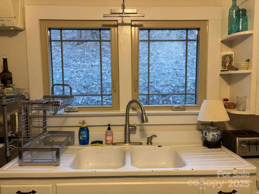 324 Marble Mine Road, Bakersville, NC 28705.  MLS# CAR4237907, YatesRealty ID 1877. Main house kitchen with beautiful farm sink
