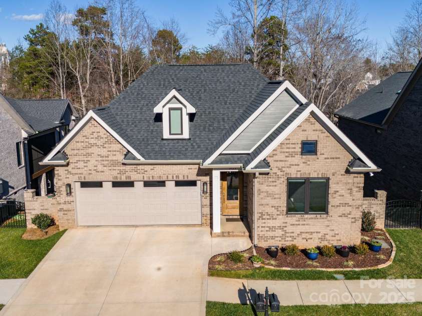 1422 Spring Ridge Lane, Denver, NC 28037.  MLS# CAR4209796, YatesRealty ID 18781. Front of home w wooded back yard