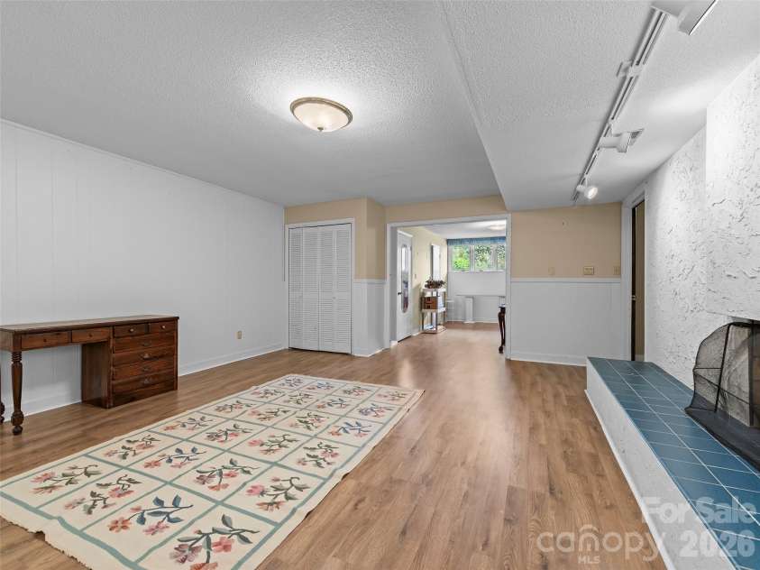 69 Forest Road, Asheville, NC 28803.  MLS# CAR4376506, YatesRealty ID 18781. Lower Level Sitting Room/Flex Space