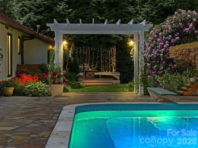 69 Forest Road, Asheville, NC 28803.  MLS# CAR4376506, YatesRealty ID 18781. Pool Cabana/Pergola Evening