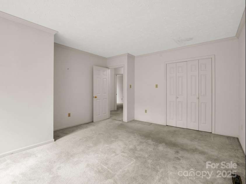 2000 Golf Course Road, Columbus, NC 28722.  MLS# CAR4268144, YatesRealty ID 18782. Bedroom two walk in closet.